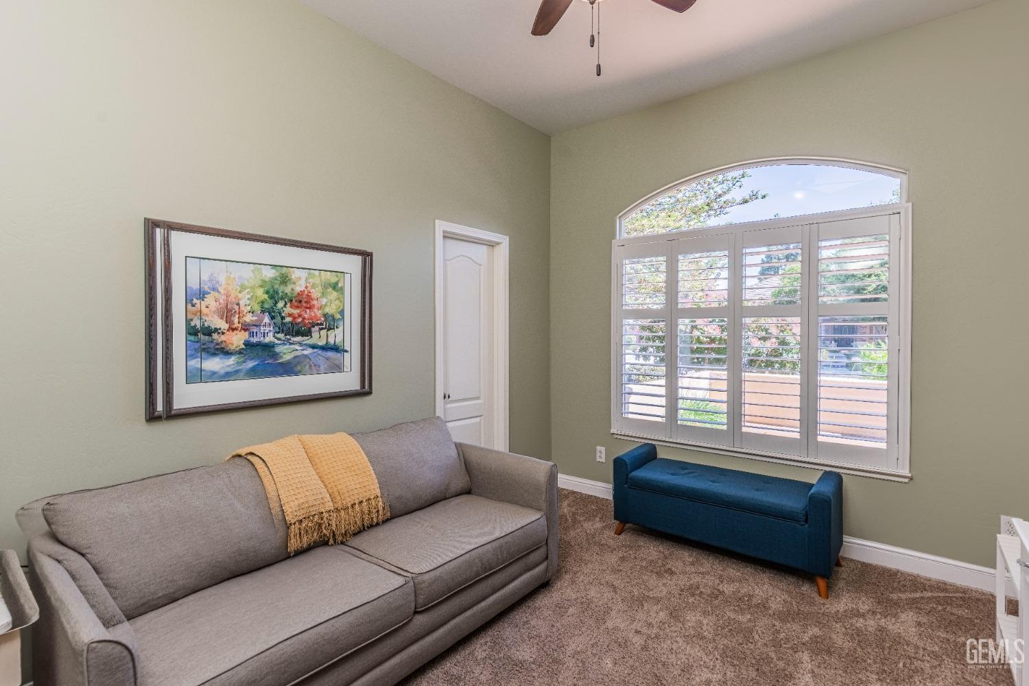 Undisclosed Address Bakersfield, CA 93312 - Photo 12 of 51 a living room with furniture and a large window