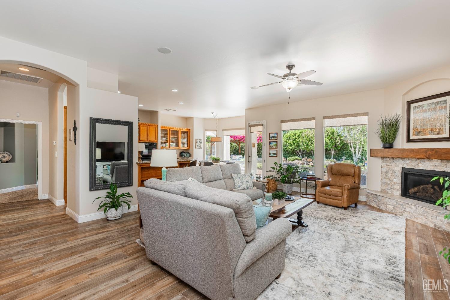 Undisclosed Address Bakersfield, CA 93312 - Photo 13 of 51 a living room with furniture fireplace and flat screen tv