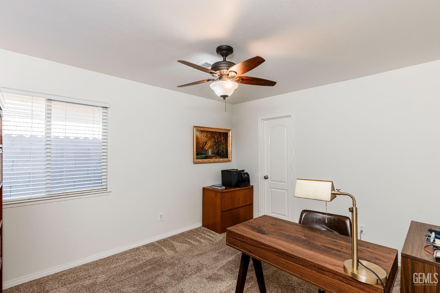 Undisclosed Address Bakersfield, CA 93312 - Photo 18 of 51 a workspace with furniture and a window