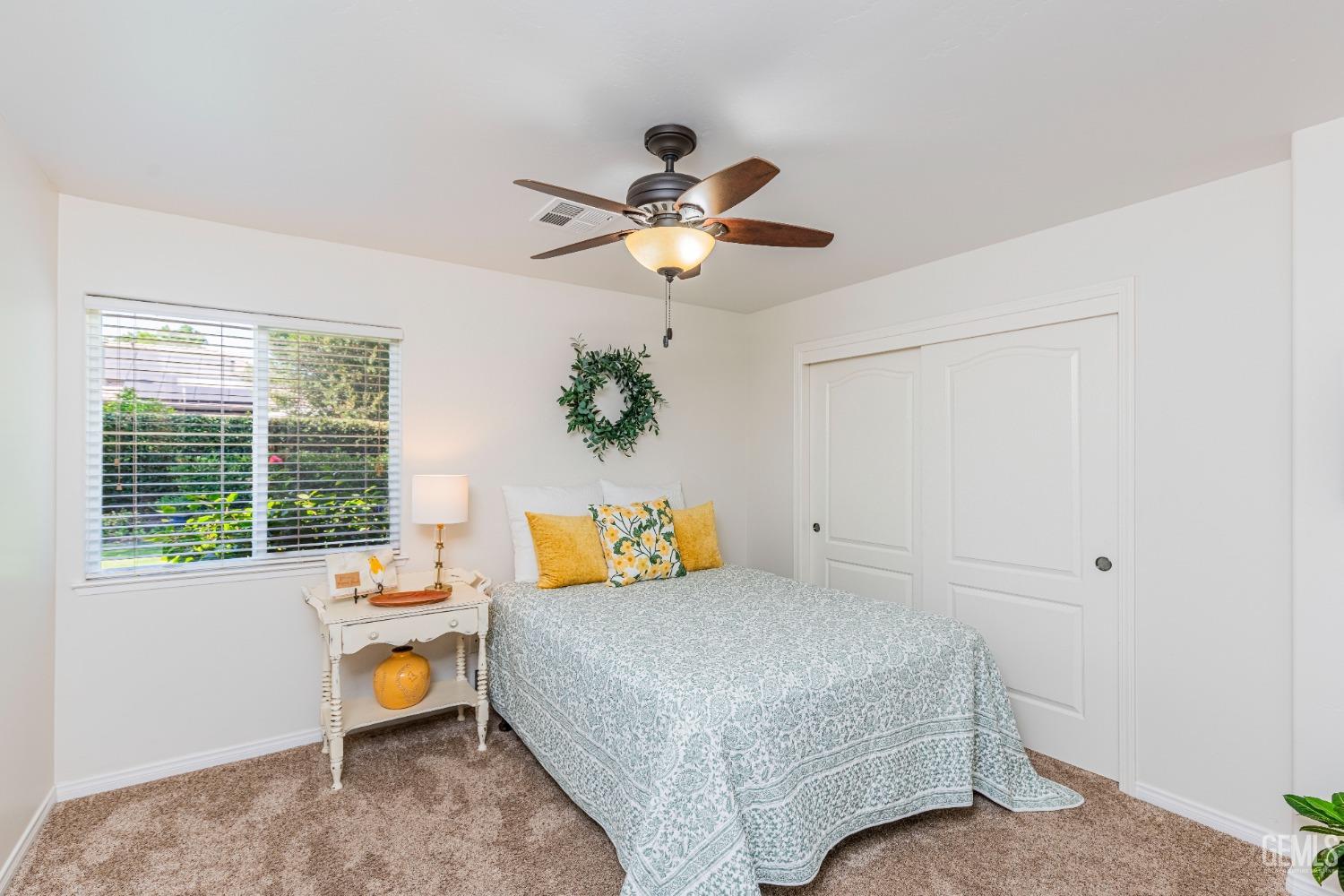 Undisclosed Address Bakersfield, CA 93312 - Photo 21 of 51 a bedroom with a bed and a chandelier