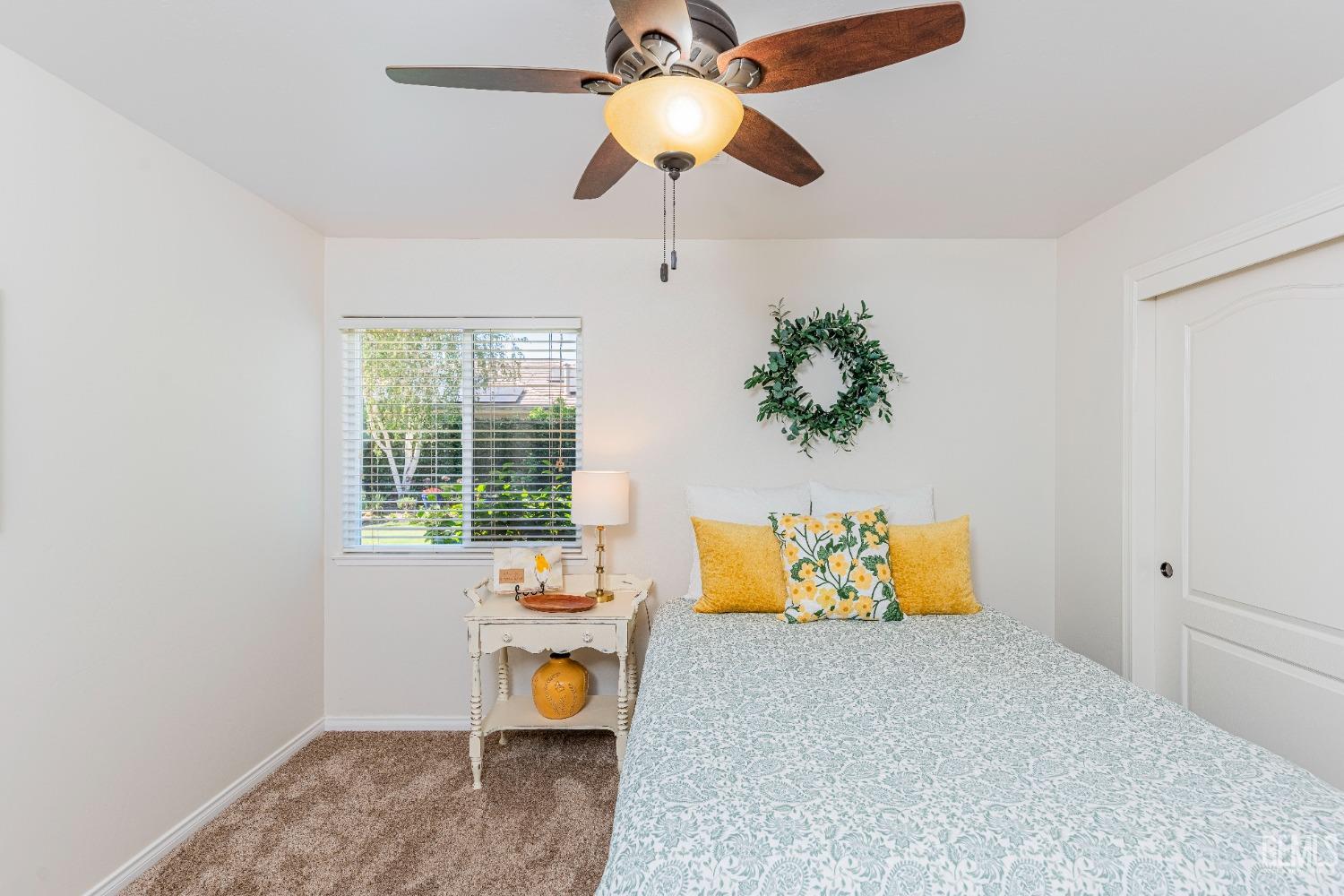 Undisclosed Address Bakersfield, CA 93312 - Photo 22 of 51 a bedroom with a bed and a chandelier