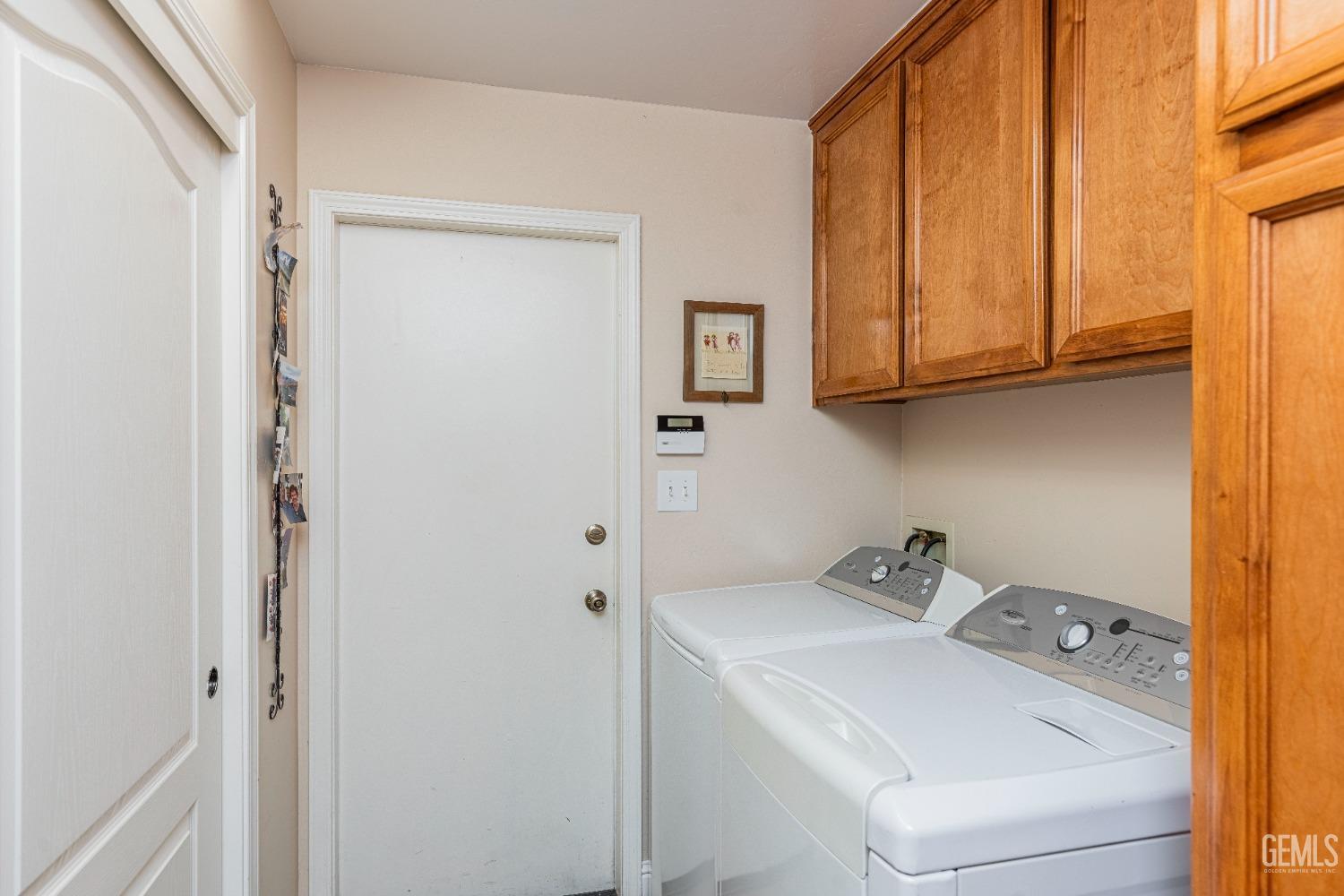 Undisclosed Address Bakersfield, CA 93312 - Photo 24 of 51 a utility room with dryer and washer