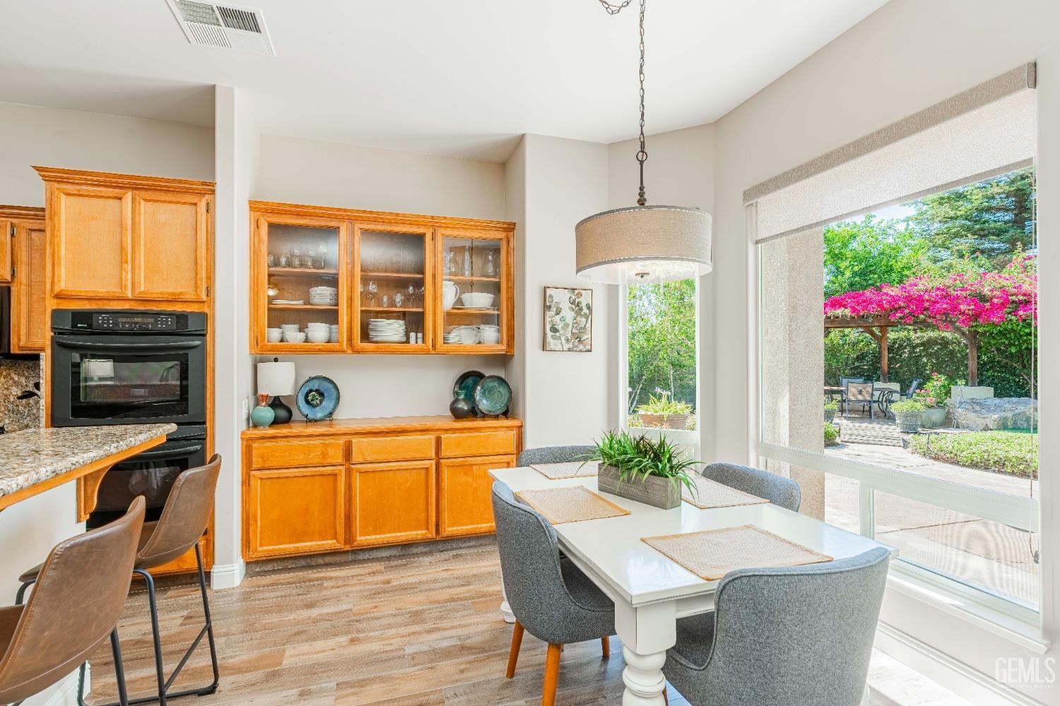 Undisclosed Address Bakersfield, CA 93312 - Photo 30 of 51 a dining room with furniture window wooden floor and a chandelier
