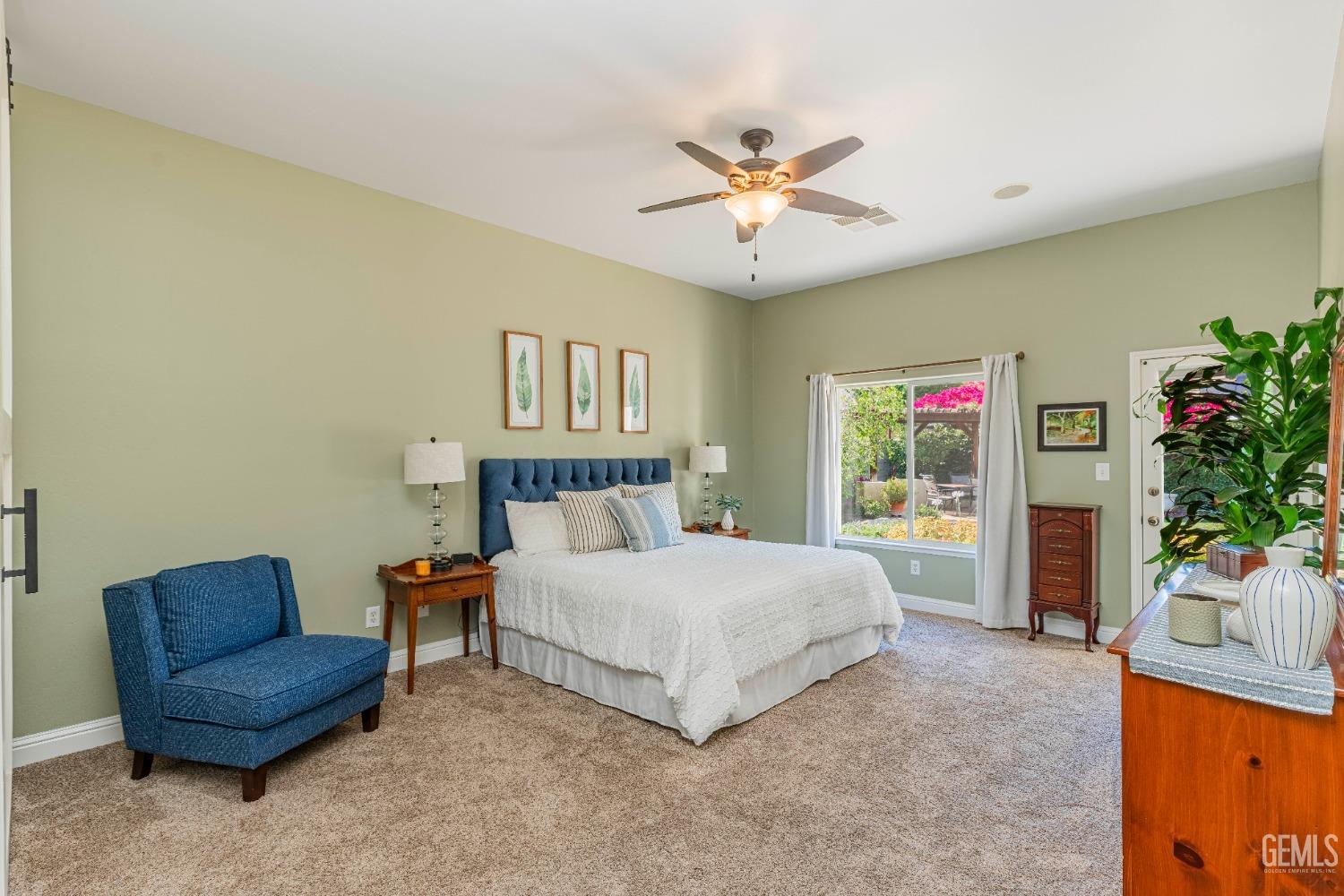 Undisclosed Address Bakersfield, CA 93312 - Photo 33 of 51 a bedroom with a bed and a chandelier