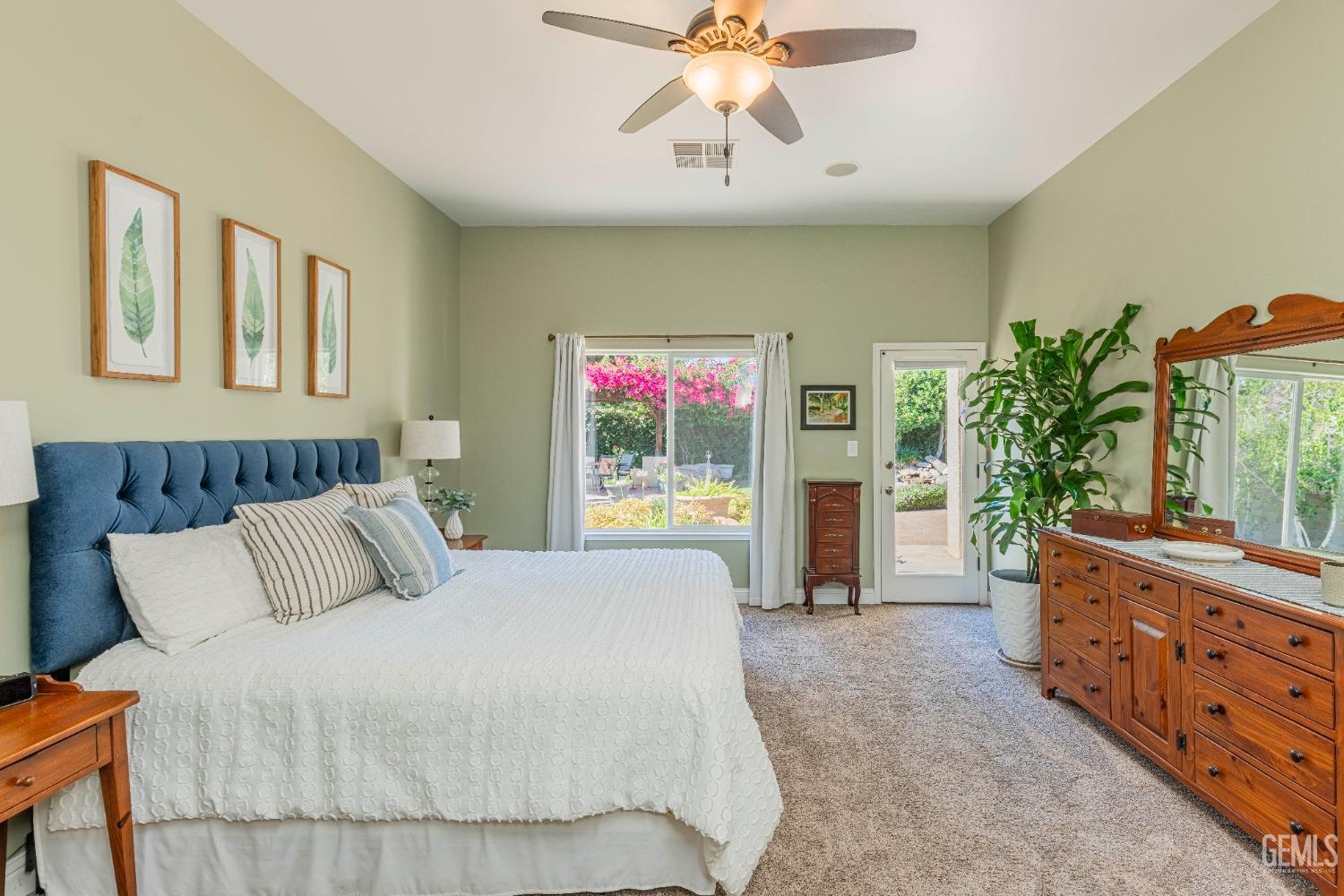 Undisclosed Address Bakersfield, CA 93312 - Photo 34 of 51 a bedroom with a large bed and a chandelier