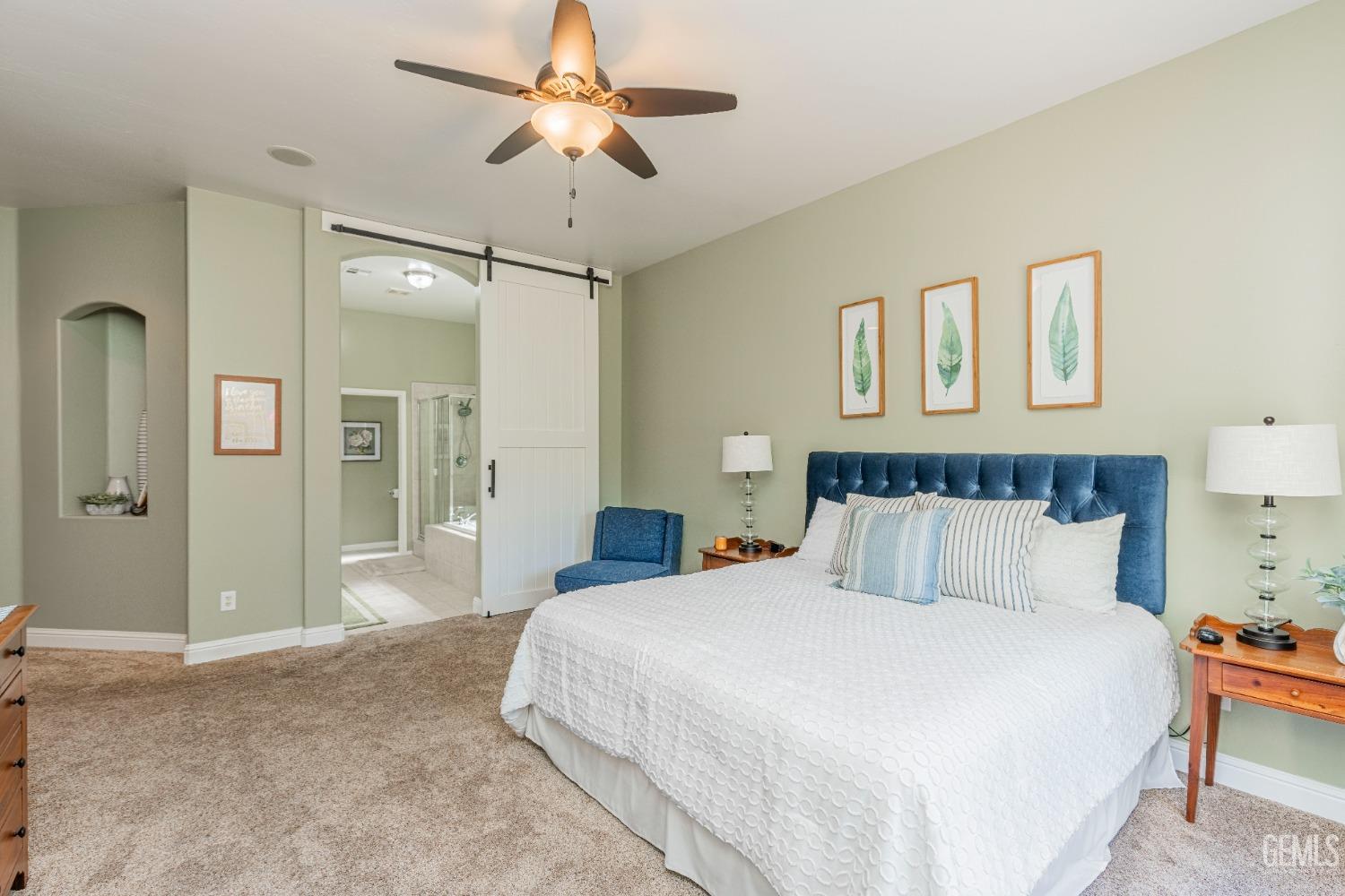 Undisclosed Address Bakersfield, CA 93312 - Photo 40 of 51 a bedroom with a large bed and a chandelier