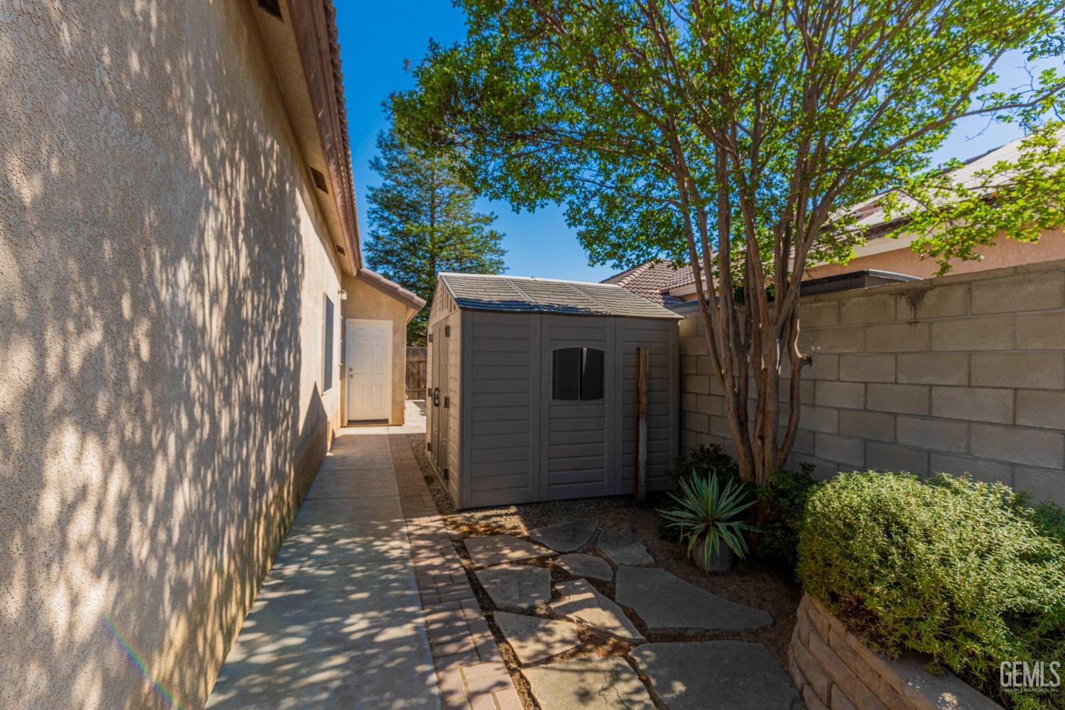 Undisclosed Address Bakersfield, CA 93312 - Photo 41 of 51 a backyard of a house with lots of green space