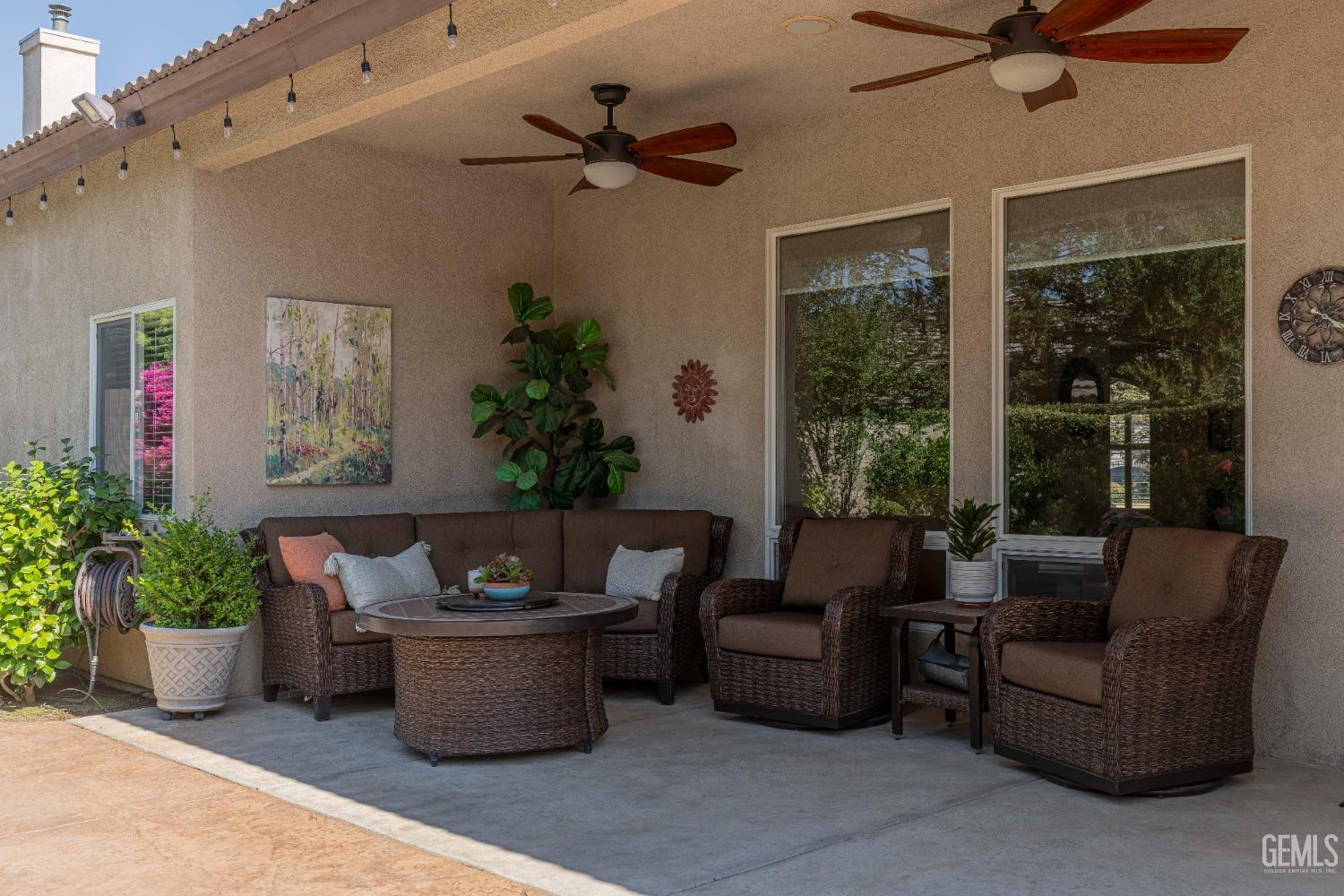 Undisclosed Address Bakersfield, CA 93312 - Photo 49 of 51 a living room with furniture and a potted plant