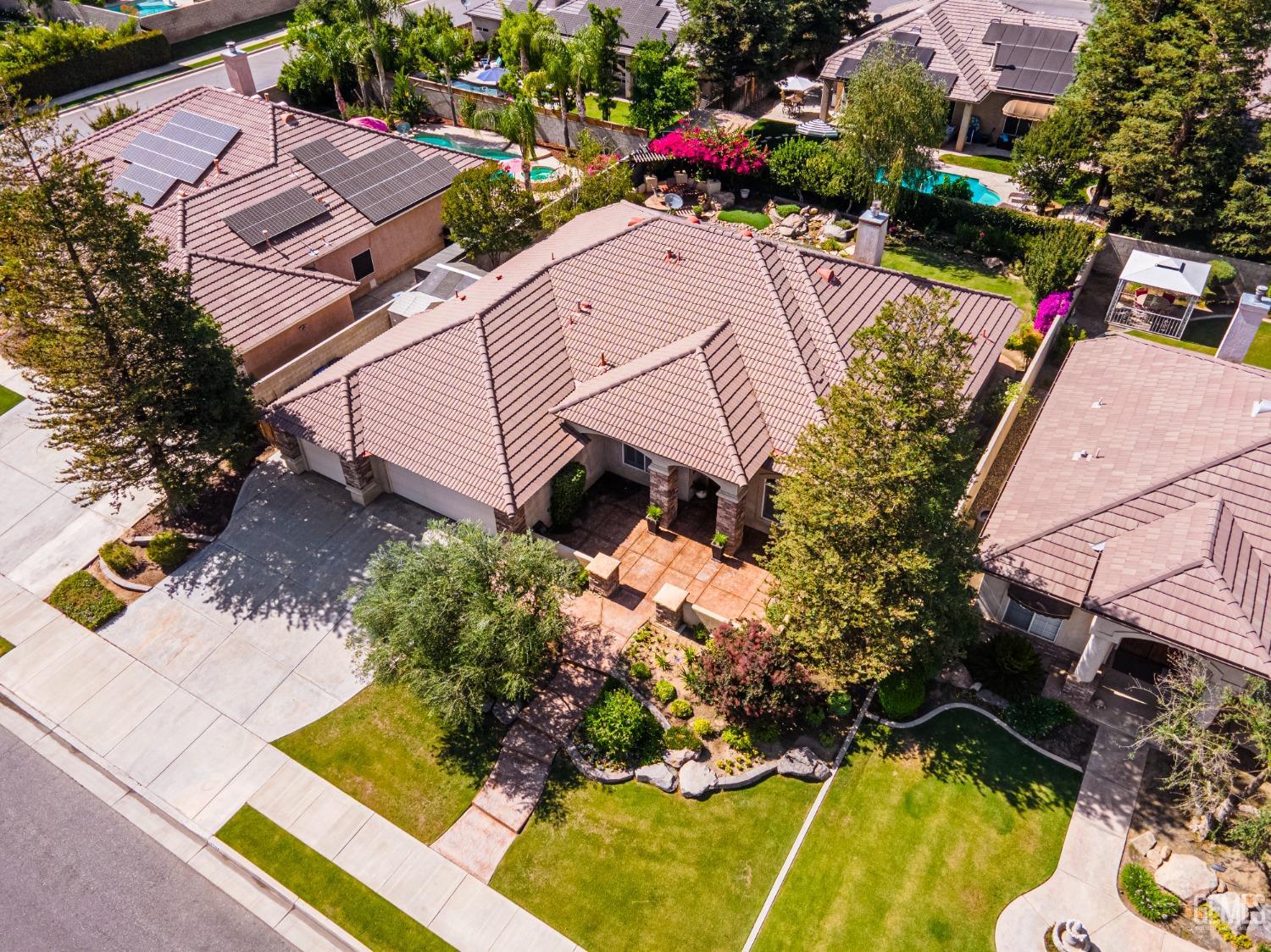Undisclosed Address Bakersfield, CA 93312 - Photo 5 of 51 an aerial view of a house with a swimming pool