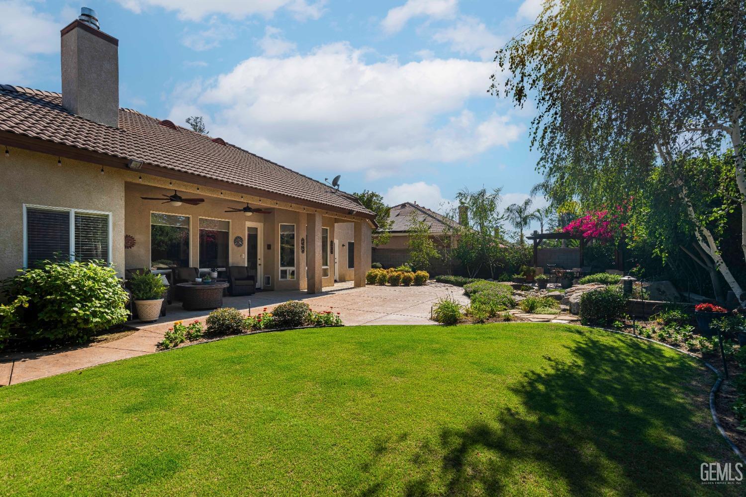 Undisclosed Address Bakersfield, CA 93312 - Photo 51 of 51 a front view of house with yard and green space
