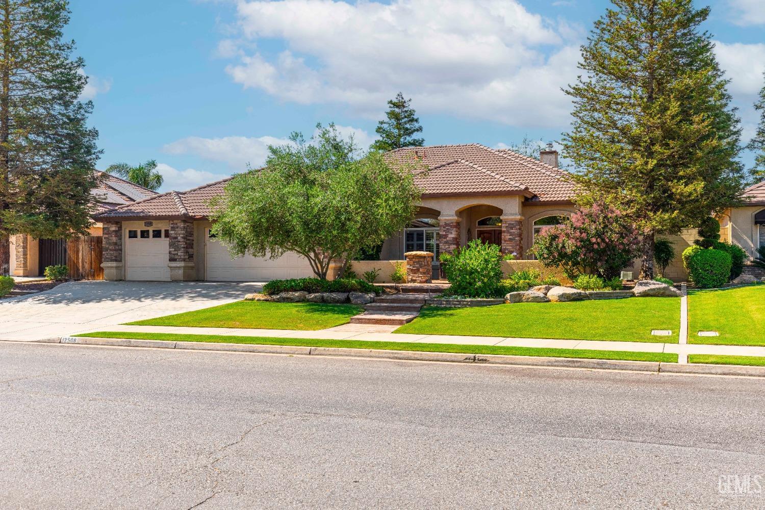 Undisclosed Address Bakersfield, CA 93312 - Photo 7 of 51 a view of swimming pool with an outdoor space and seating area