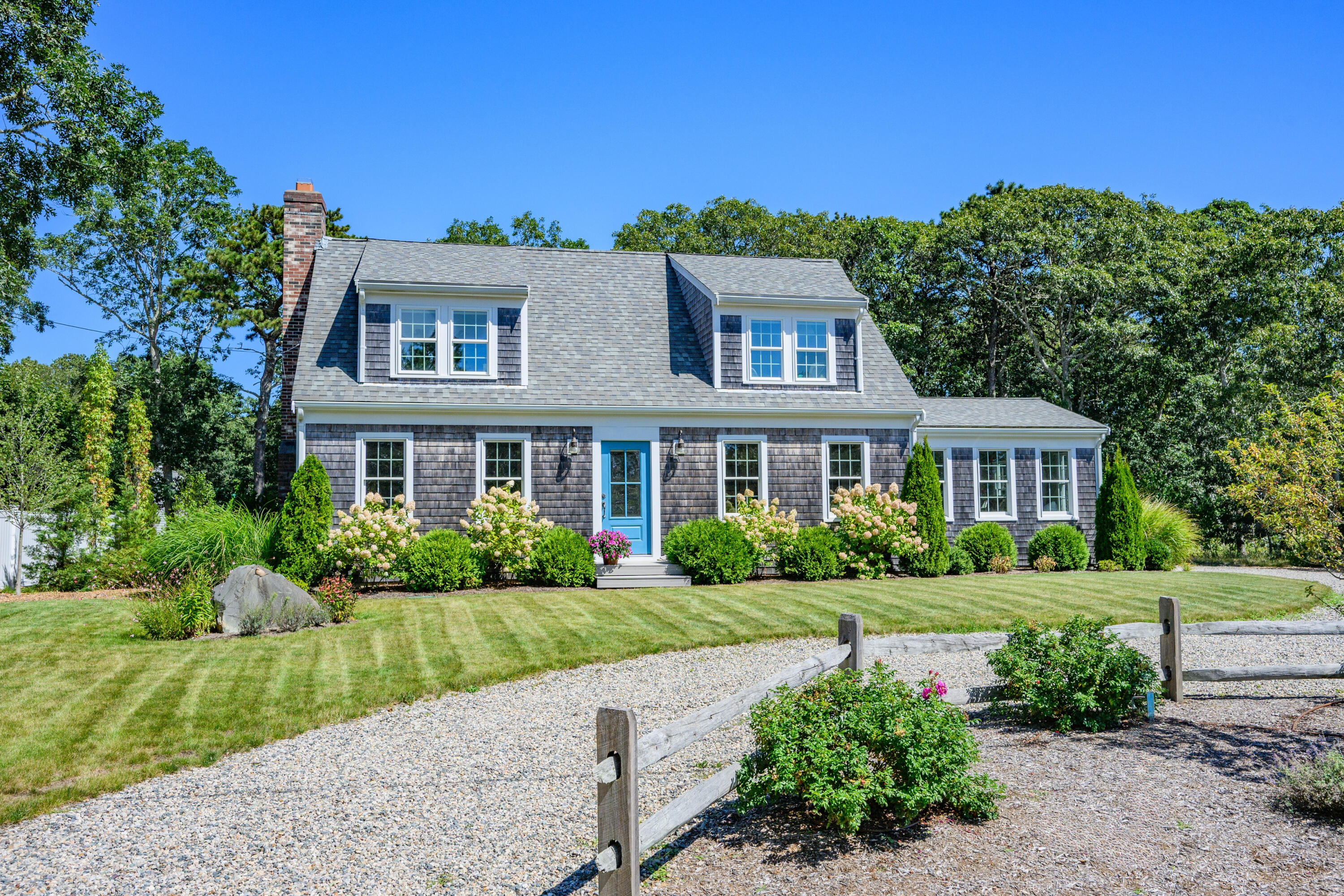 19 Burning Bush Way Brewster, MA 02631 - Photo 37 of 54 a front view of a house with a yard