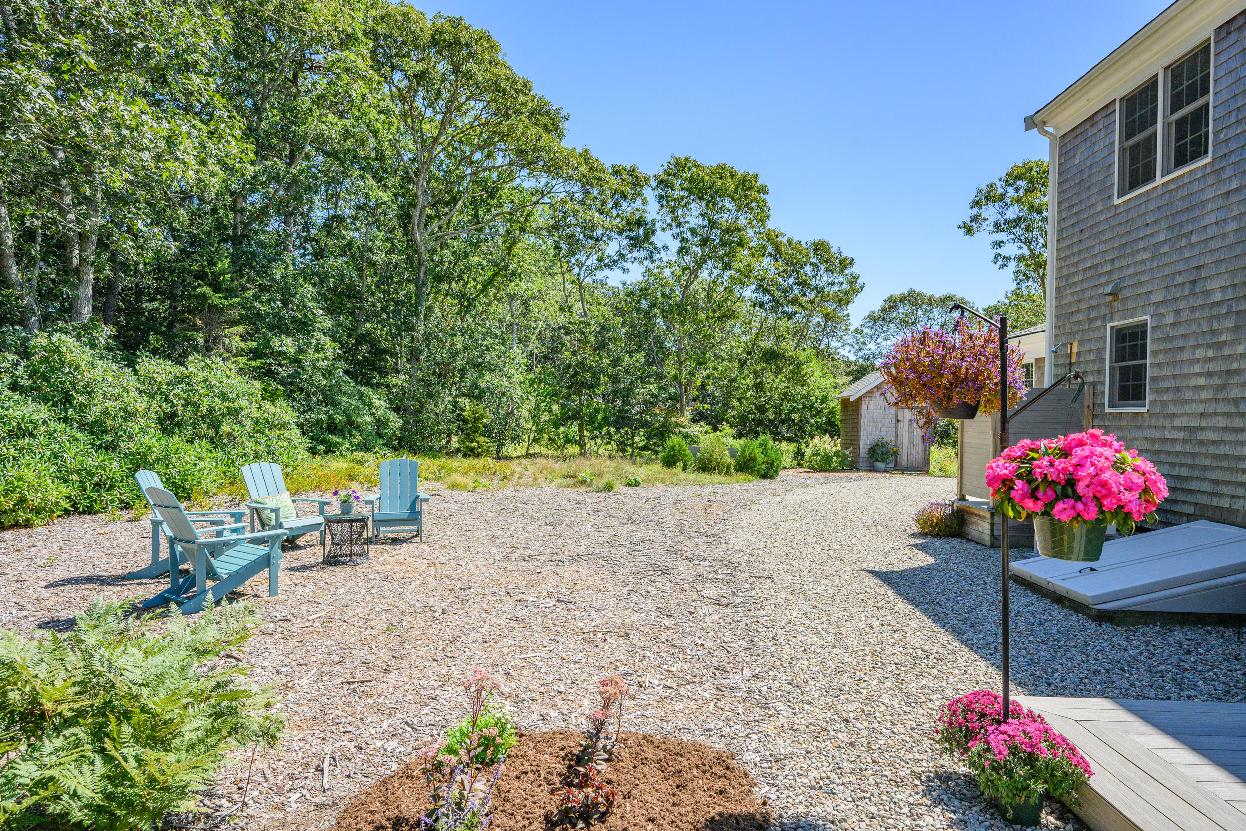 19 Burning Bush Way Brewster, MA 02631 - Photo 45 of 54 a outdoor space with lots of potted plants