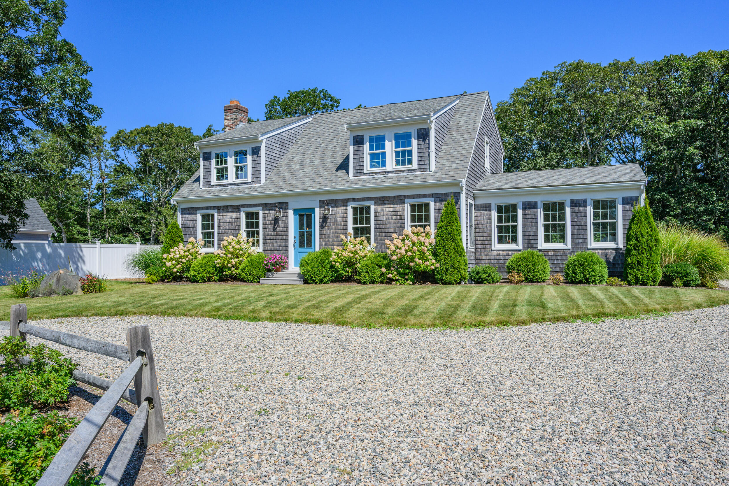 19 Burning Bush Way Brewster, MA 02631 - Photo 53 of 54 a front view of a house with a yard