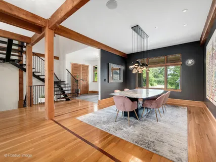 a view of entryway with wooden floor and stairs