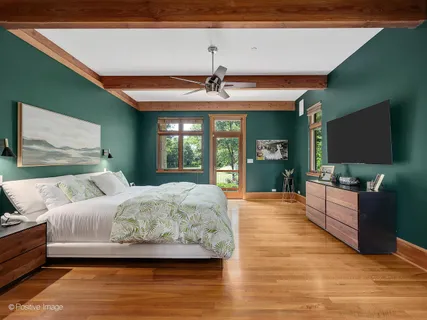 a bedroom with a bed and dresser
