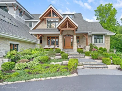 a view of entryway with wooden floor and stairs