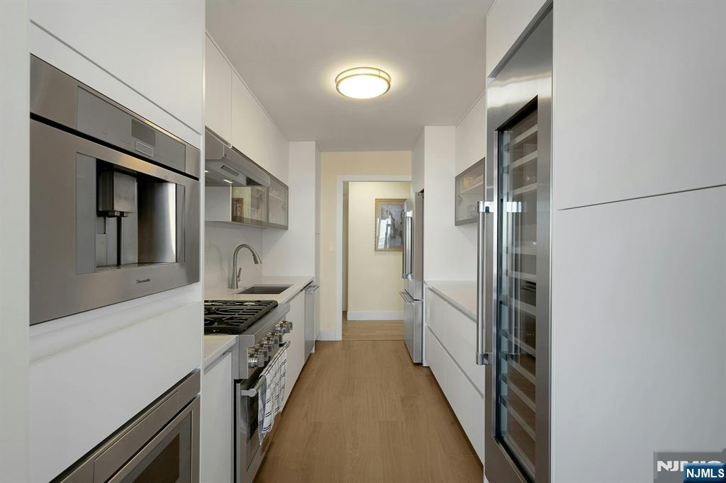 6 Horizon Road, Unit 2602 Fort Lee, NJ 07024 - Photo 13 of 45 a kitchen with stainless steel appliances a refrigerator and a sink