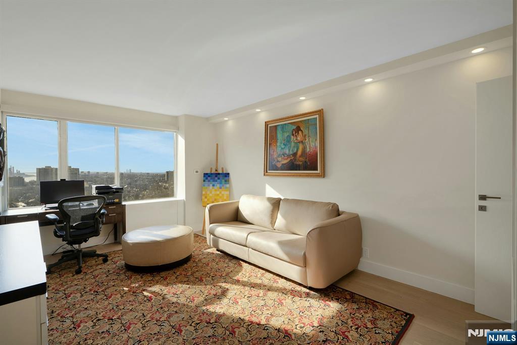 6 Horizon Road, Unit 2602 Fort Lee, NJ 07024 - Photo 24 of 45 a living room with furniture and a couch