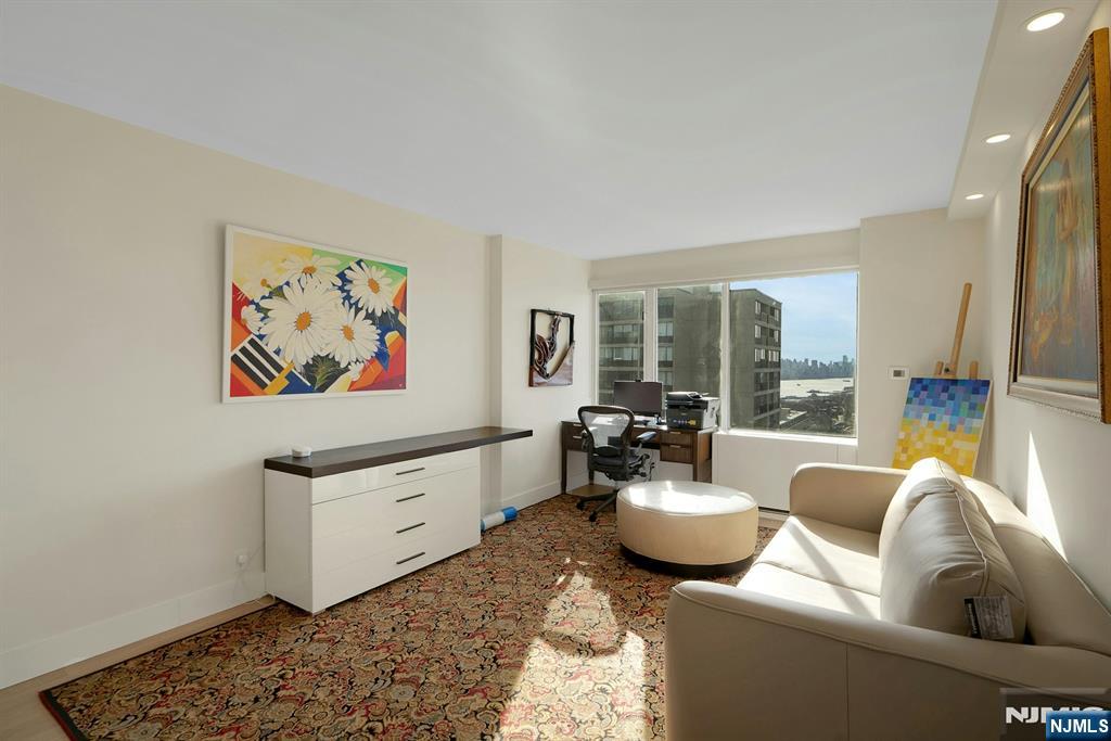 6 Horizon Road, Unit 2602 Fort Lee, NJ 07024 - Photo 26 of 45 a living room with furniture and a rug