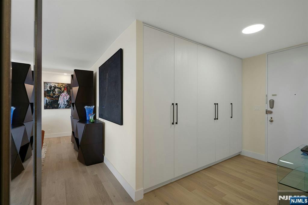 6 Horizon Road, Unit 2602 Fort Lee, NJ 07024 - Photo 5 of 45 a view of a storage & utility room with a refrigerator