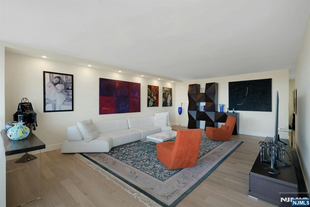 6 Horizon Road, Unit 2602 Fort Lee, NJ 07024 - Photo 6 of 45 a living room with furniture rug and window