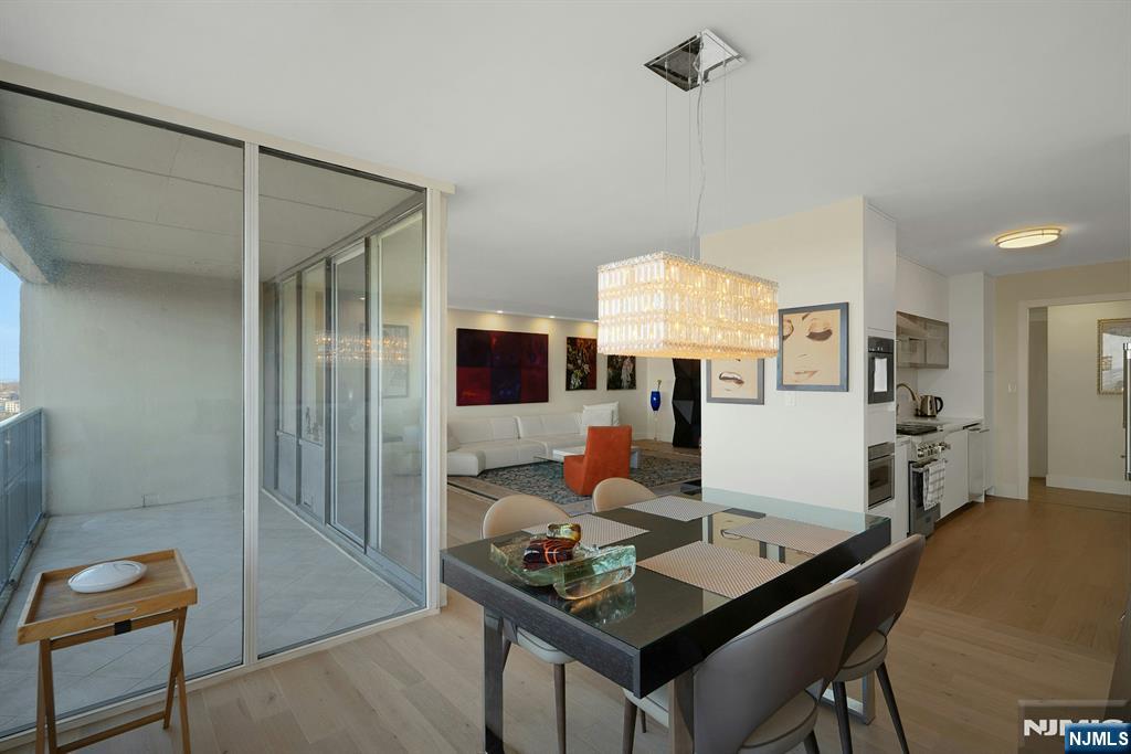 6 Horizon Road, Unit 2602 Fort Lee, NJ 07024 - Photo 10 of 45 a living room with furniture and a table