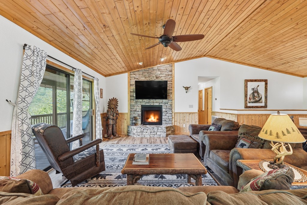 445 Tranquil Cove Road Murphy, NC 28906 - Photo 38 of 91 a living room with furniture and a flat screen tv