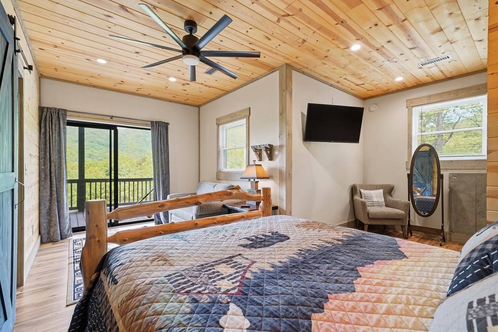 445 Tranquil Cove Road Murphy, NC 28906 - Photo 63 of 91 a bedroom with a bed and a large window with the outer view