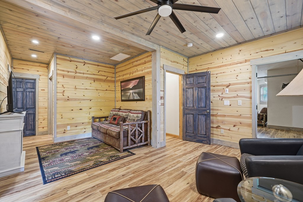 445 Tranquil Cove Road Murphy, NC 28906 - Photo 66 of 91 a living room with furniture and a flat screen tv
