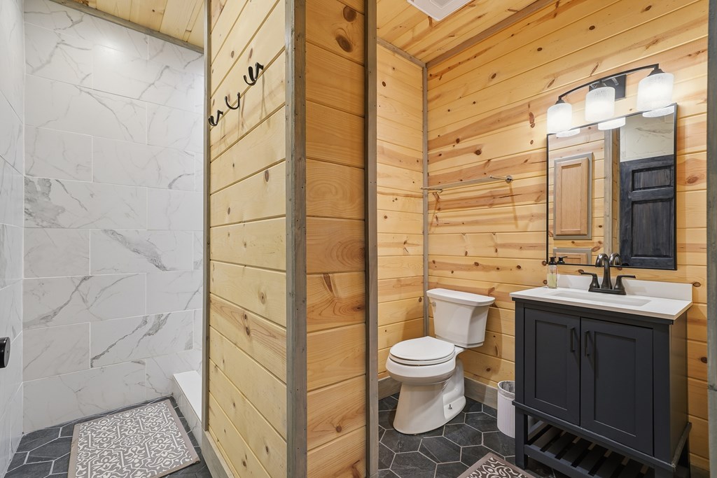 445 Tranquil Cove Road Murphy, NC 28906 - Photo 68 of 91 a bathroom with a toilet sink and shower