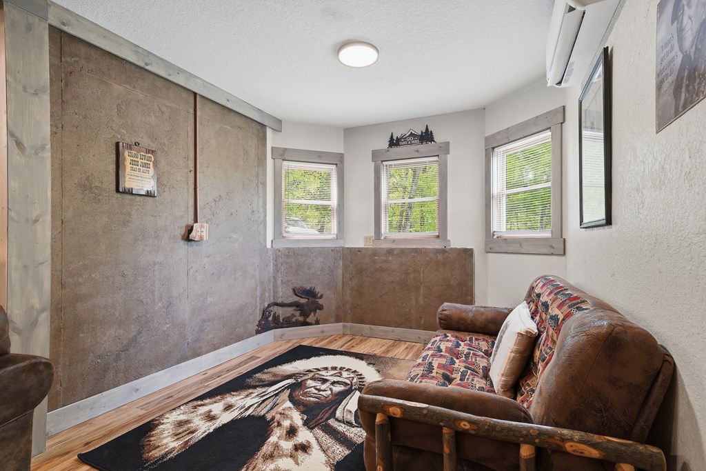 445 Tranquil Cove Road Murphy, NC 28906 - Photo 73 of 91 a bedroom with a bed and wooden floor
