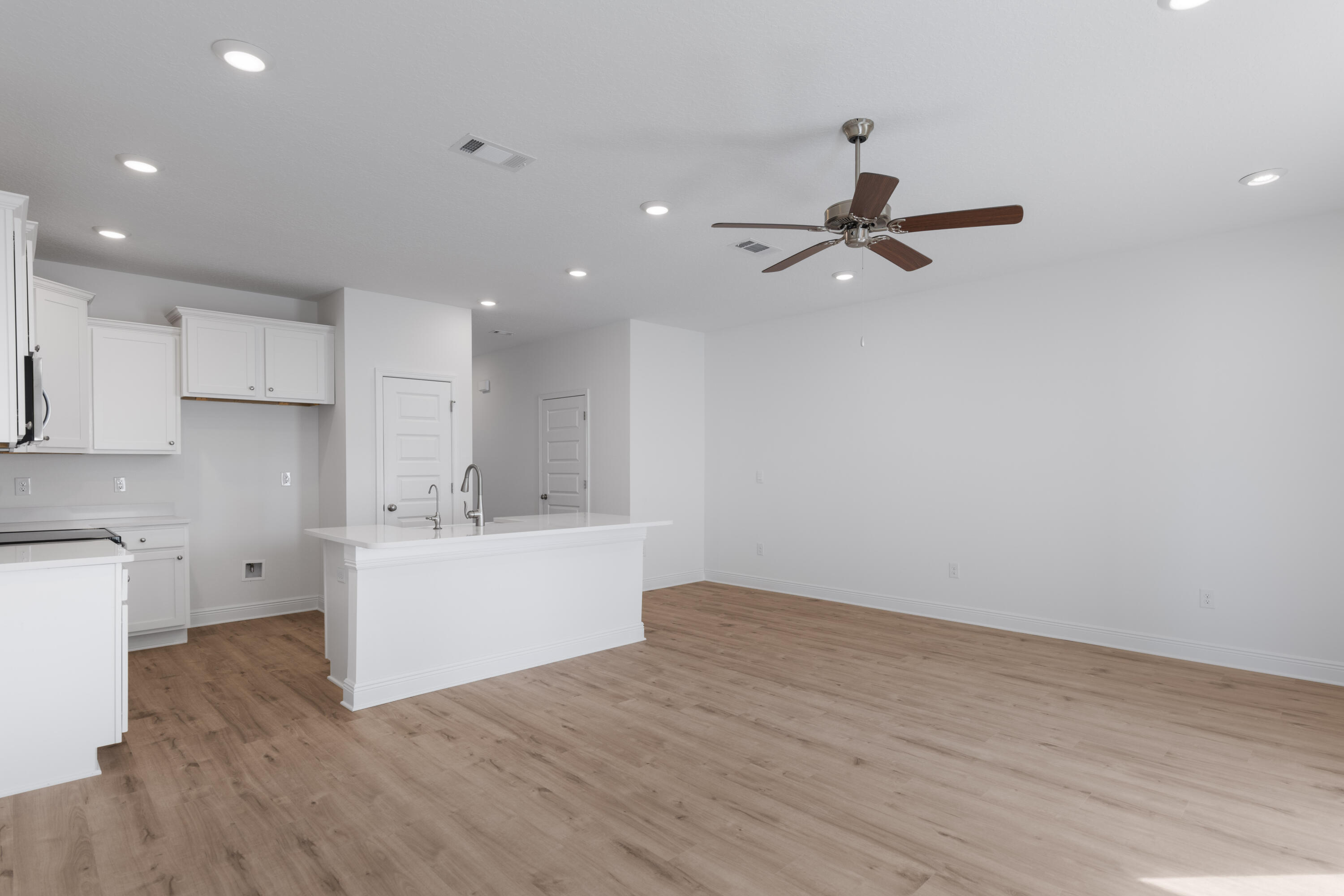 30 Redbird Loop Destin, FL 32541 - Photo 11 of 23 a view of a kitchen with a sink and a stove