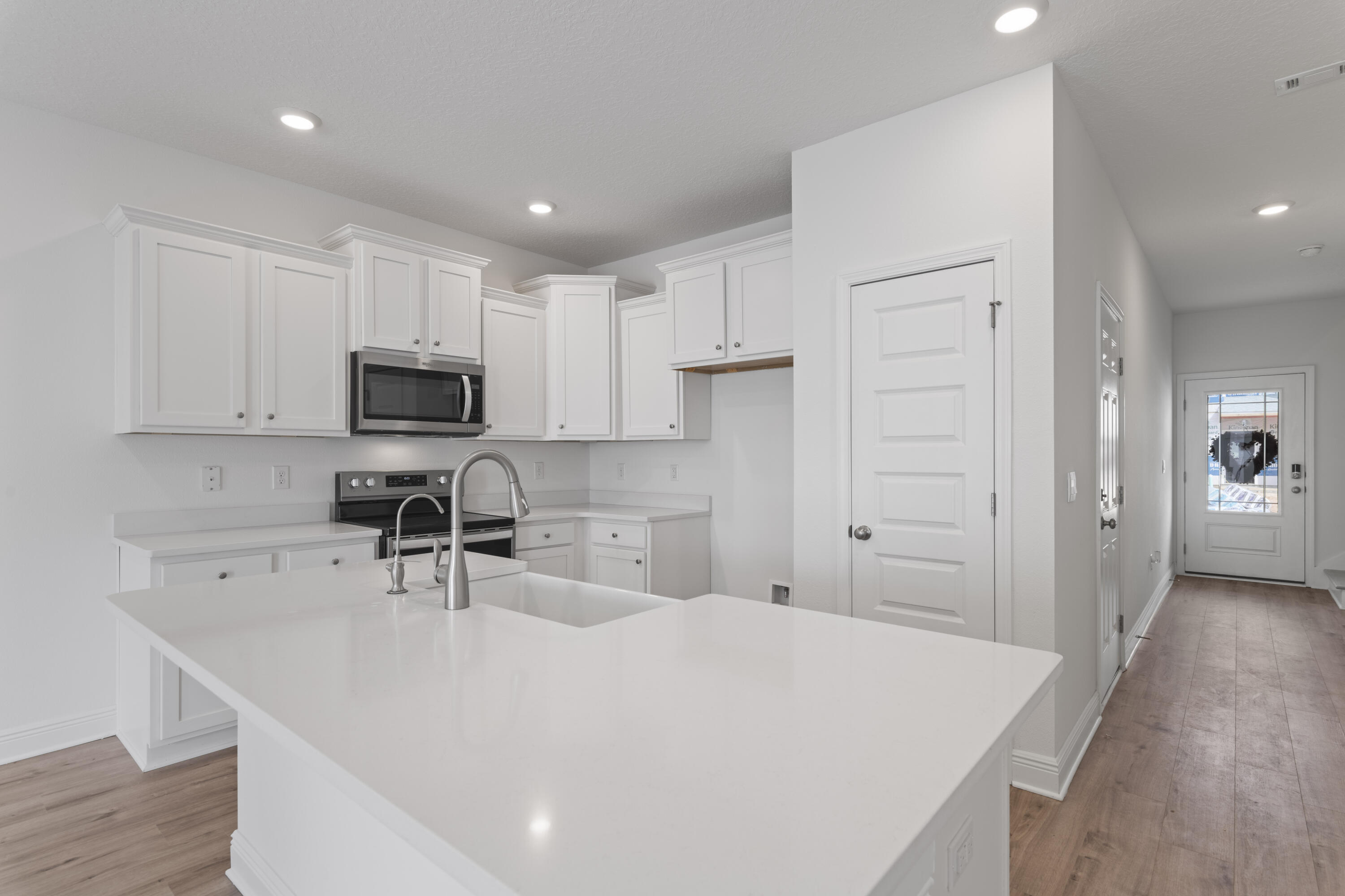 30 Redbird Loop Destin, FL 32541 - Photo 12 of 23 a kitchen with kitchen island a sink stainless steel appliances and cabinets