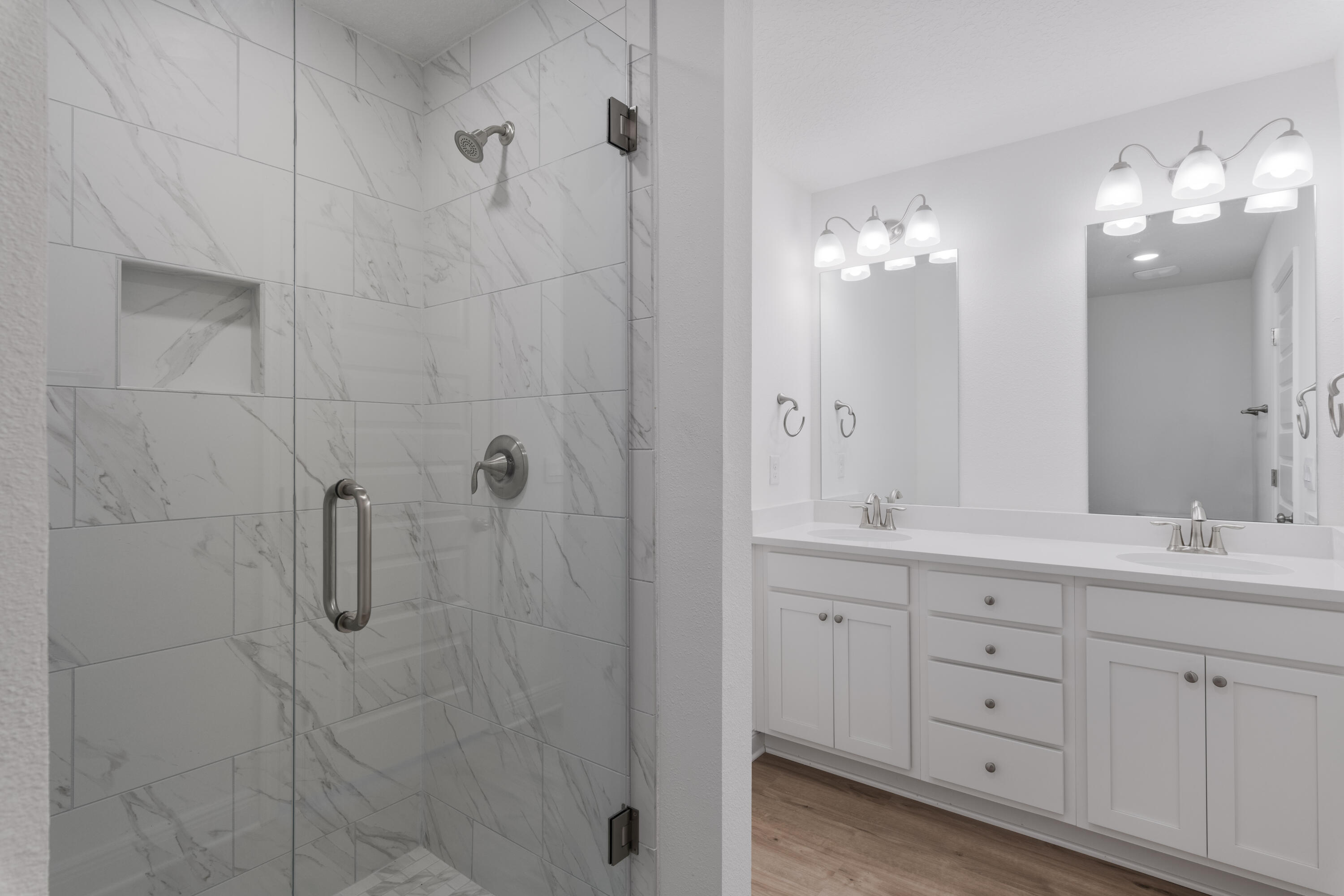 30 Redbird Loop Destin, FL 32541 - Photo 17 of 23 a bathroom with a double vanity sink mirror and shower