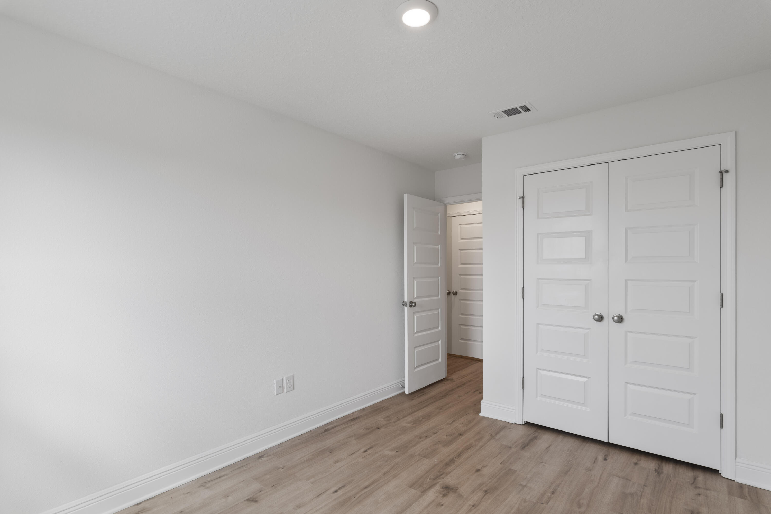 30 Redbird Loop Destin, FL 32541 - Photo 19 of 23 a view of an empty room and wooden floor
