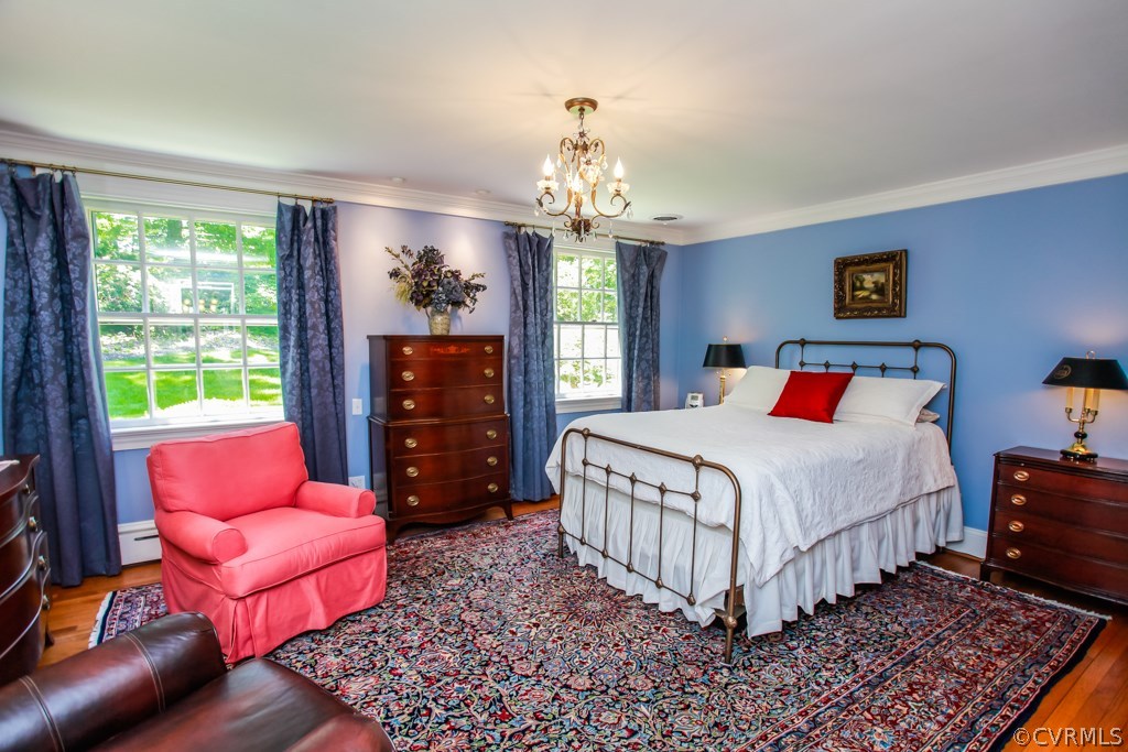 3641 Old Gun Road Midlothian, VA 23113 - Photo 13 of 24 a bedroom with a bed and wooden floor