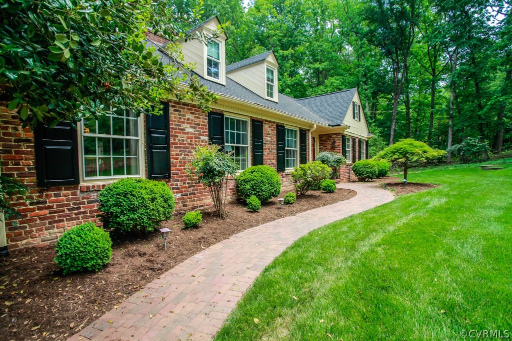 3641 Old Gun Road Midlothian, VA 23113 - Photo 2 of 24 a front view of a house with garden