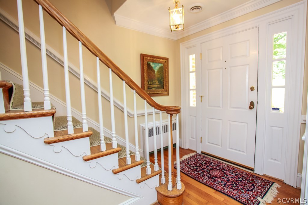 3641 Old Gun Road Midlothian, VA 23113 - Photo 3 of 24 a view of an entryway with wooden floor and staircase