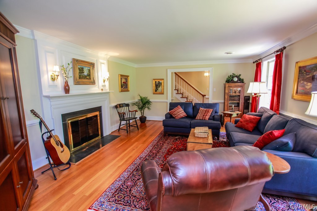 3641 Old Gun Road Midlothian, VA 23113 - Photo 4 of 24 a living room with furniture and a fireplace
