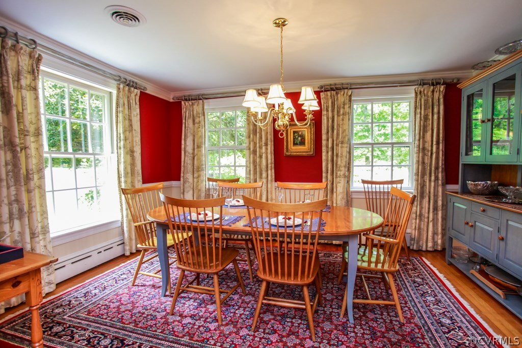 3641 Old Gun Road Midlothian, VA 23113 - Photo 7 of 24 a view of a dining room with furniture window and wooden floor