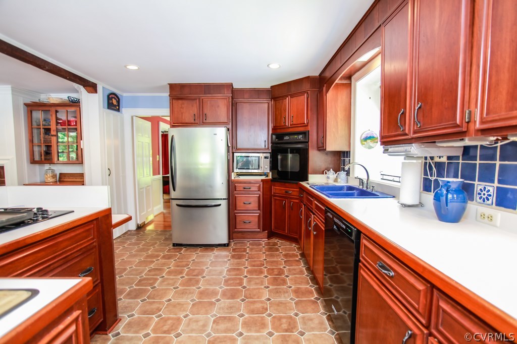 3641 Old Gun Road Midlothian, VA 23113 - Photo 10 of 24 a kitchen with a refrigerator a sink and a stove