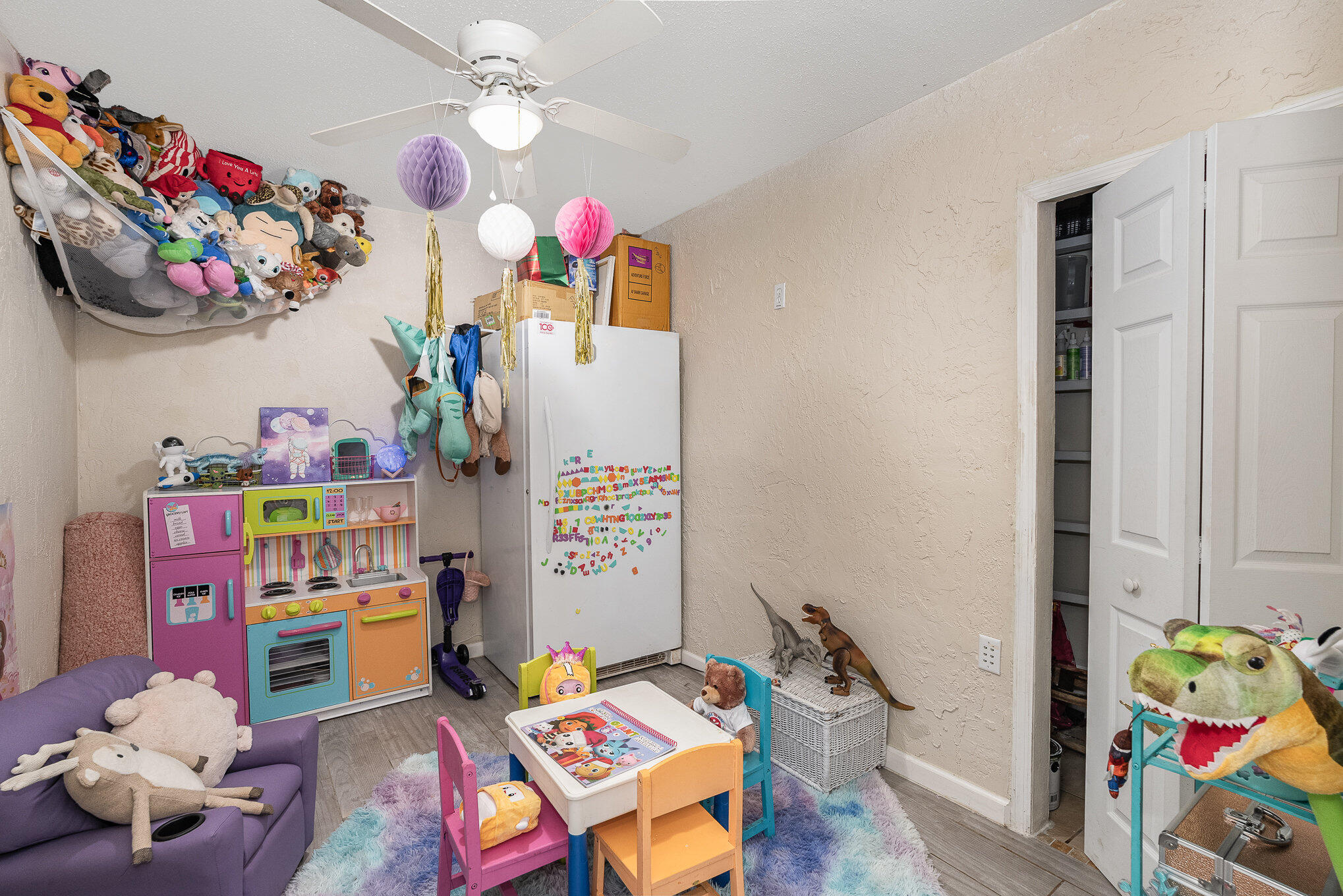 1420 Creel Road Northeast Palm Bay, FL 32905 - Photo 16 of 27 a bedroom with toys and a book shelf