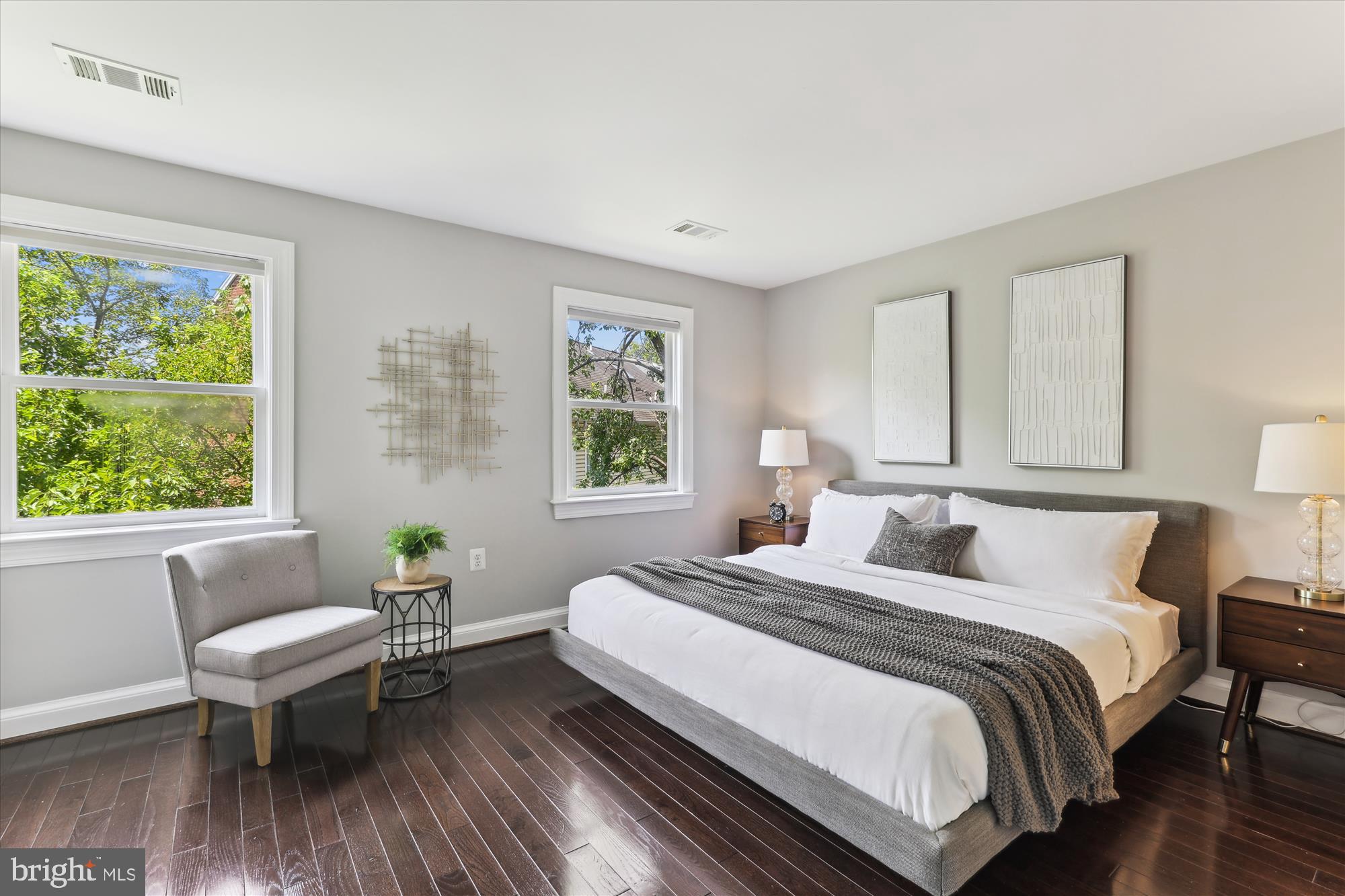 1406 Foxhall Road Northwest Washington, DC 20007 - Photo 13 of 41 a bedroom with a bed and a wooden floor