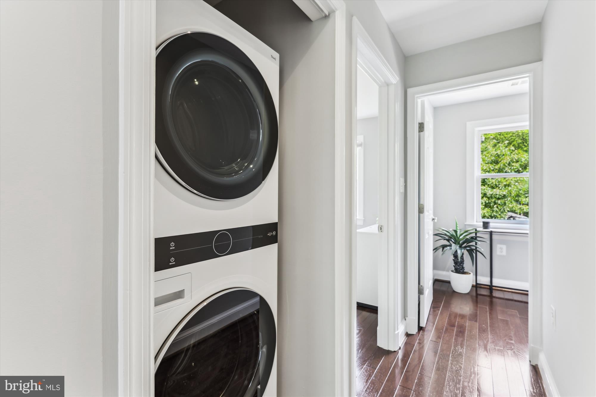 1406 Foxhall Road Northwest Washington, DC 20007 - Photo 17 of 41 a view of a hallway with washer and dryer