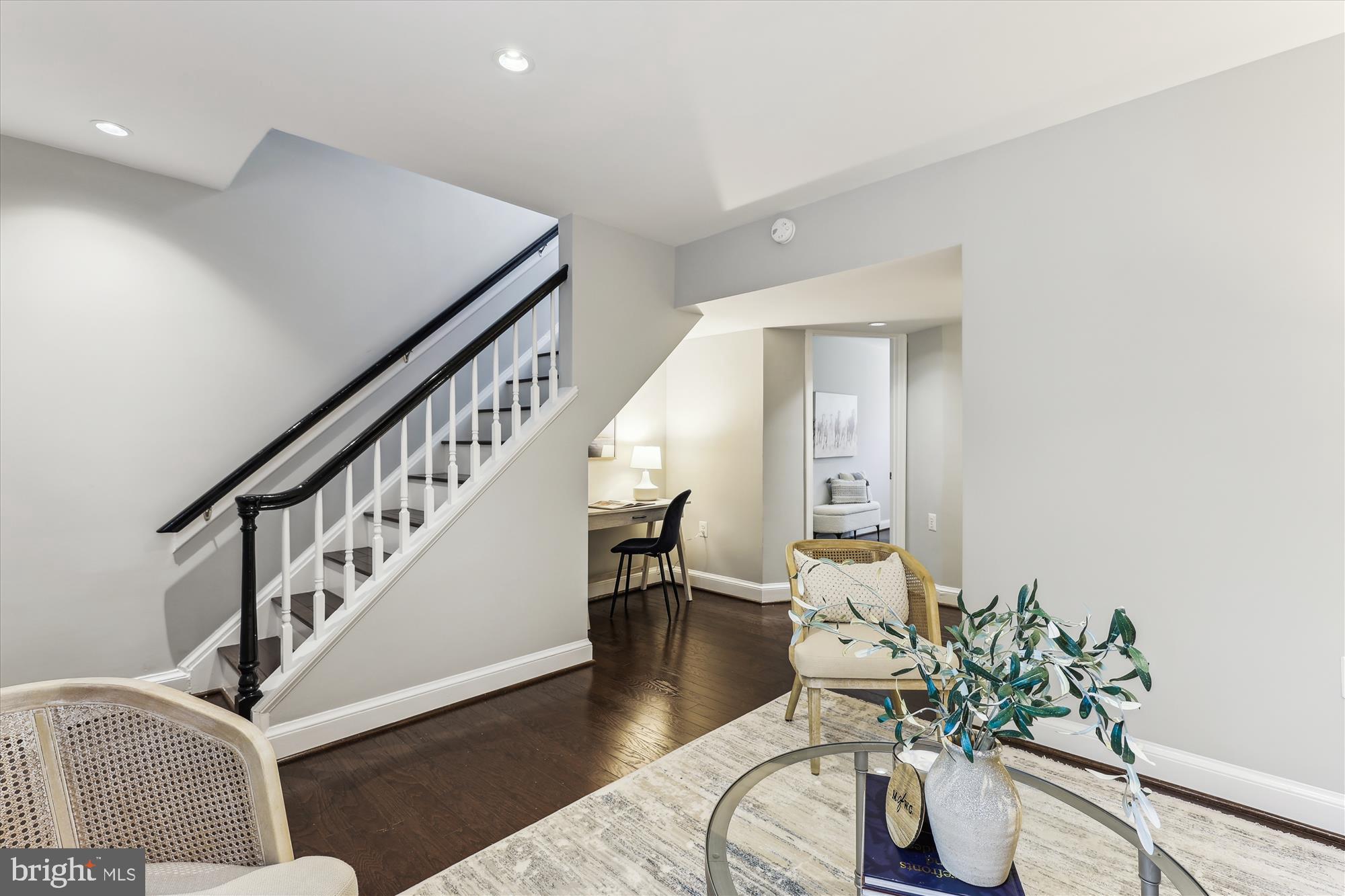 1406 Foxhall Road Northwest Washington, DC 20007 - Photo 21 of 41 a living room with furniture and a potted plant