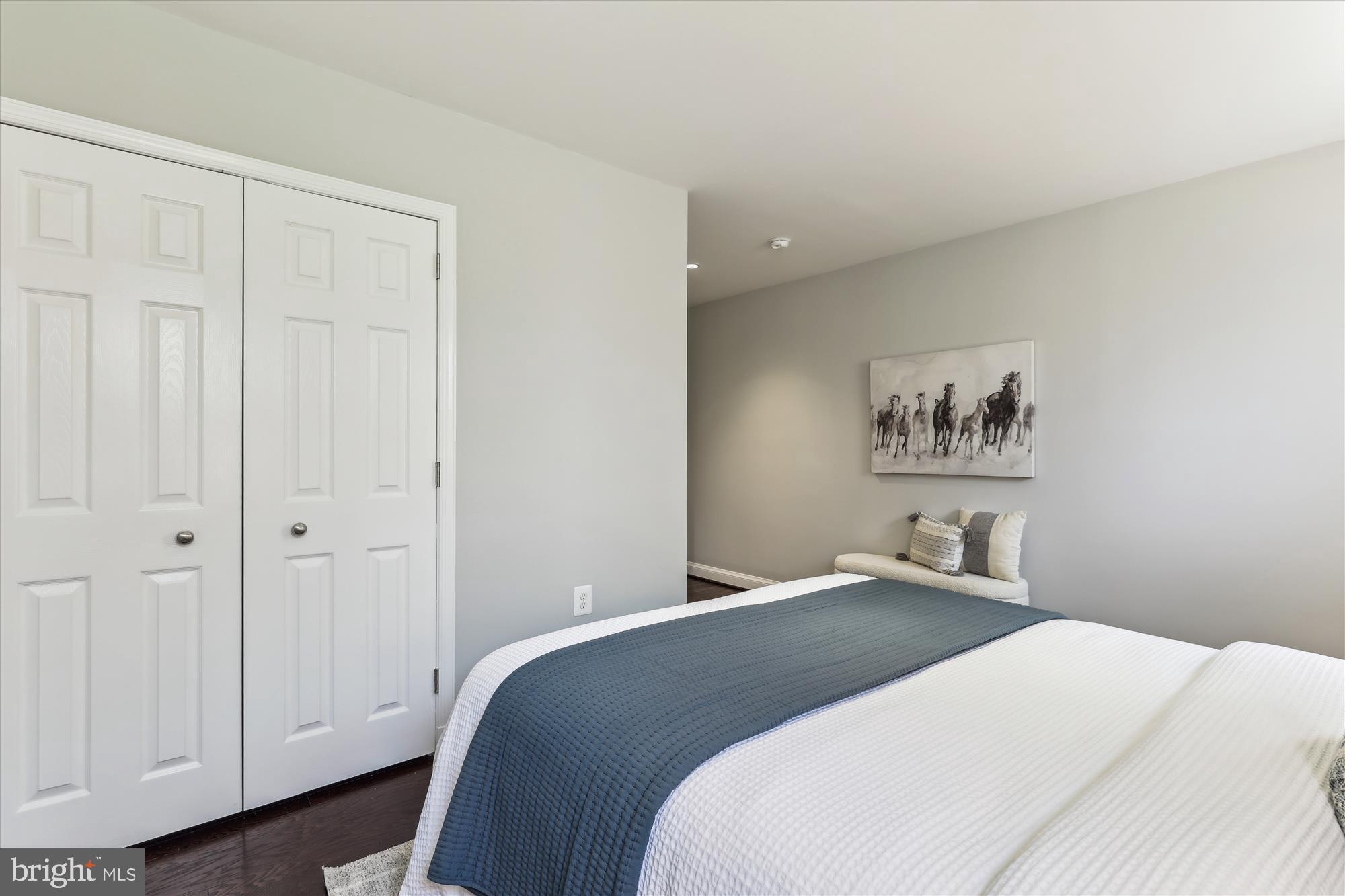 1406 Foxhall Road Northwest Washington, DC 20007 - Photo 24 of 41 a bedroom with a bed and a painting on the wall