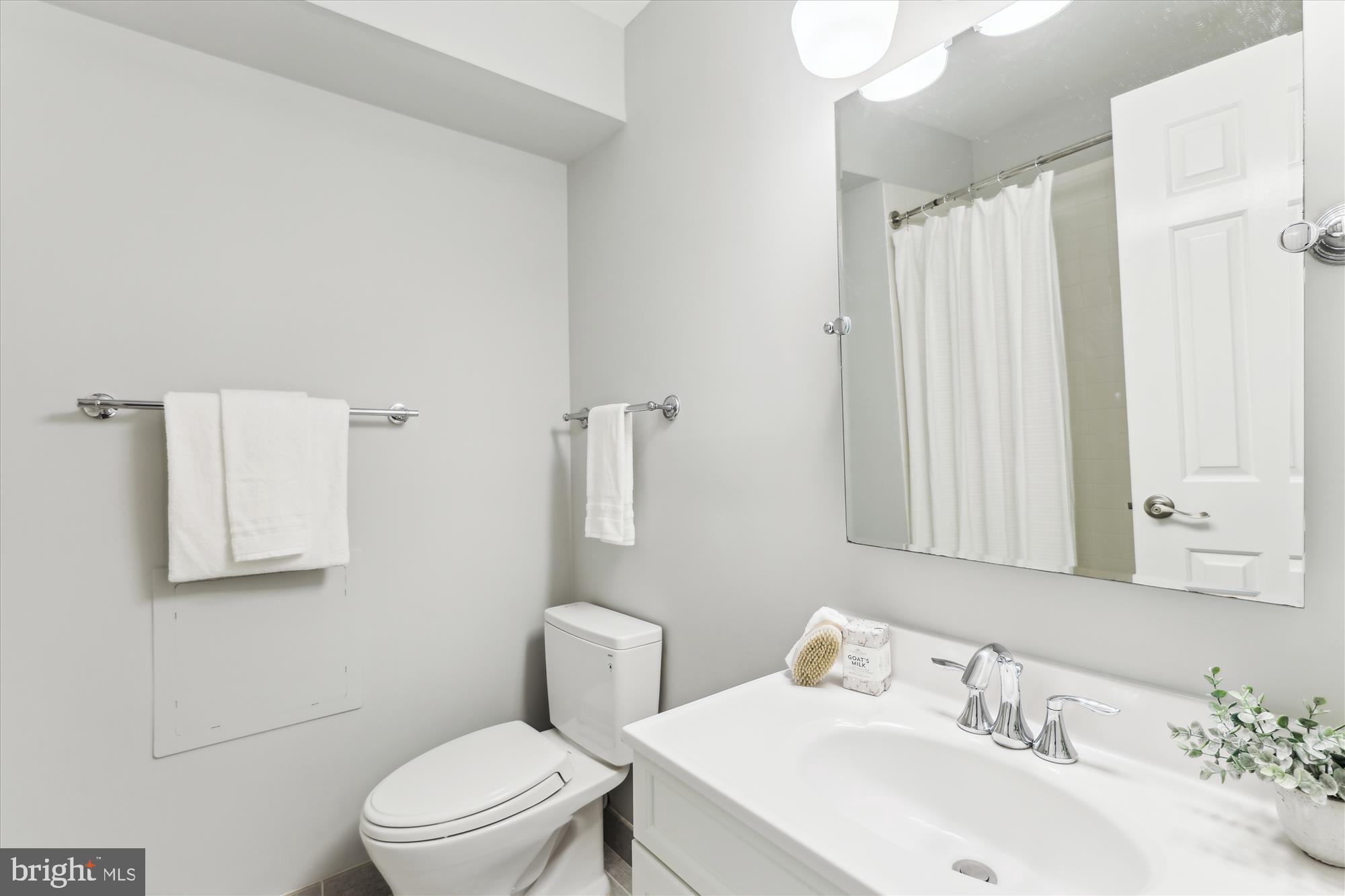 1406 Foxhall Road Northwest Washington, DC 20007 - Photo 27 of 41 a bathroom with a sink toilet and shower