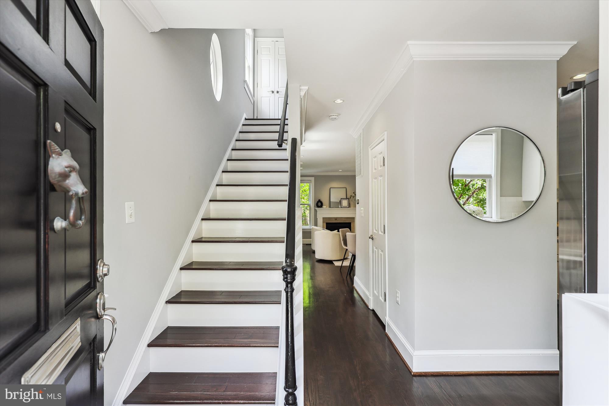 1406 Foxhall Road Northwest Washington, DC 20007 - Photo 3 of 41 a view of a hallway with wooden floor and entryway
