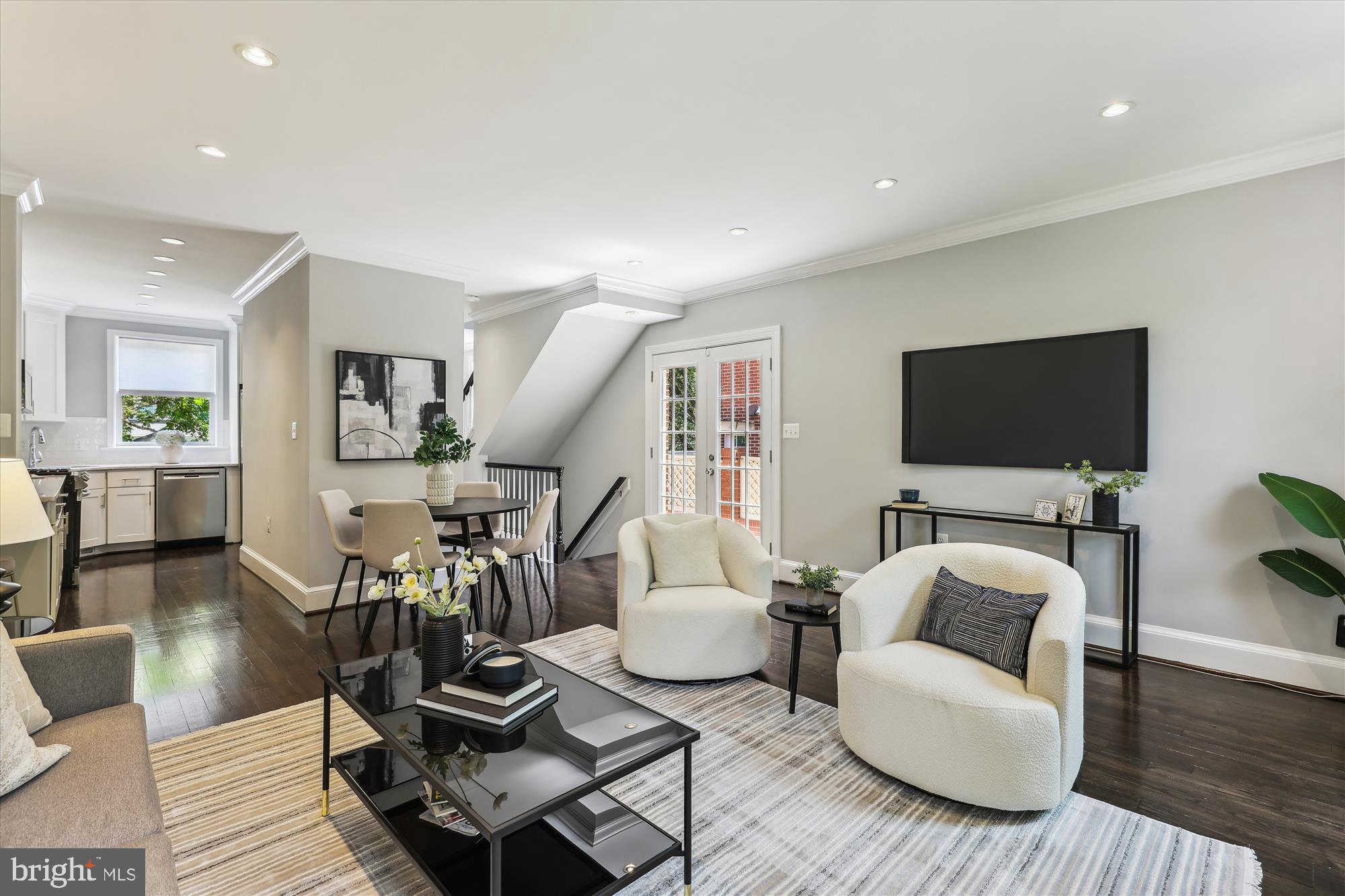 1406 Foxhall Road Northwest Washington, DC 20007 - Photo 6 of 41 a living room with furniture and a flat screen tv